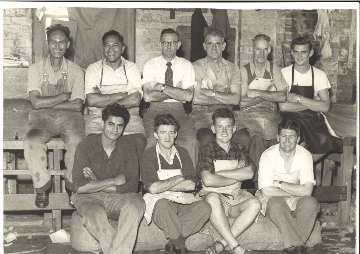 S. R. Suckling and factory workers in a 1940s family archive photograph.
