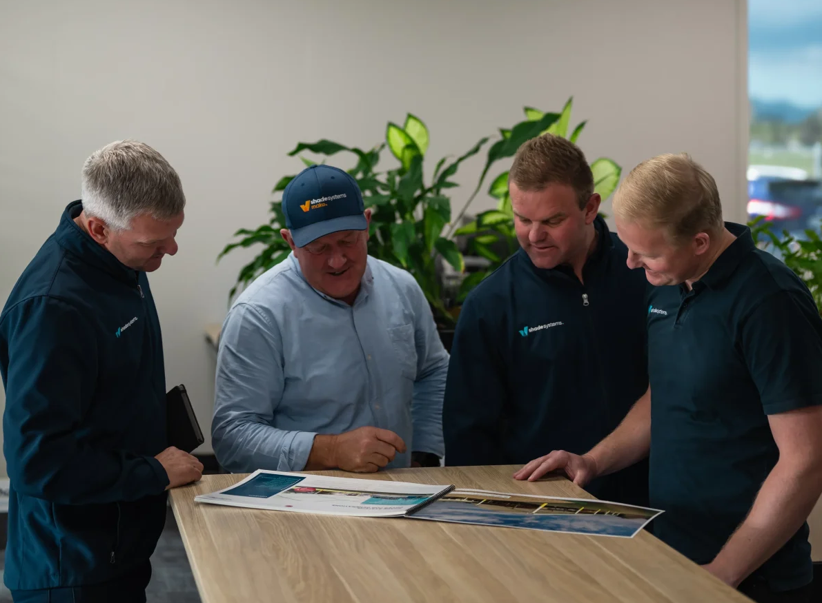 Luke, Derek, Barney and Nick Suckling reviewing plans at ShadeSpace.